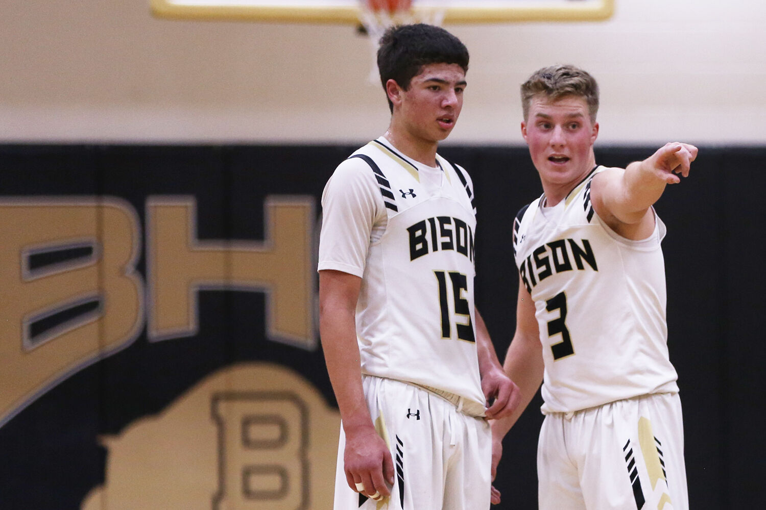 Hyrum Hatch talks with freshman Eli Patterson